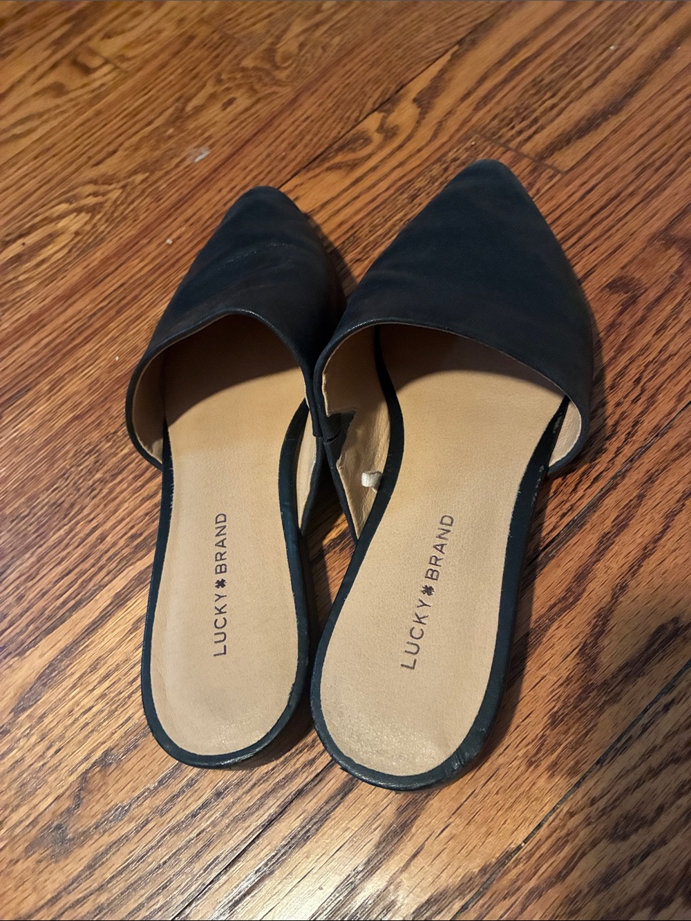Lucky Brand Black Pointed Toe Bairey Slide Flats. Genuine leather upper.